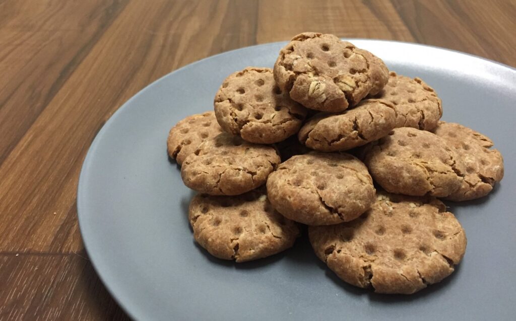 Three-Ingredient Dog Biscuits on a blue plate.