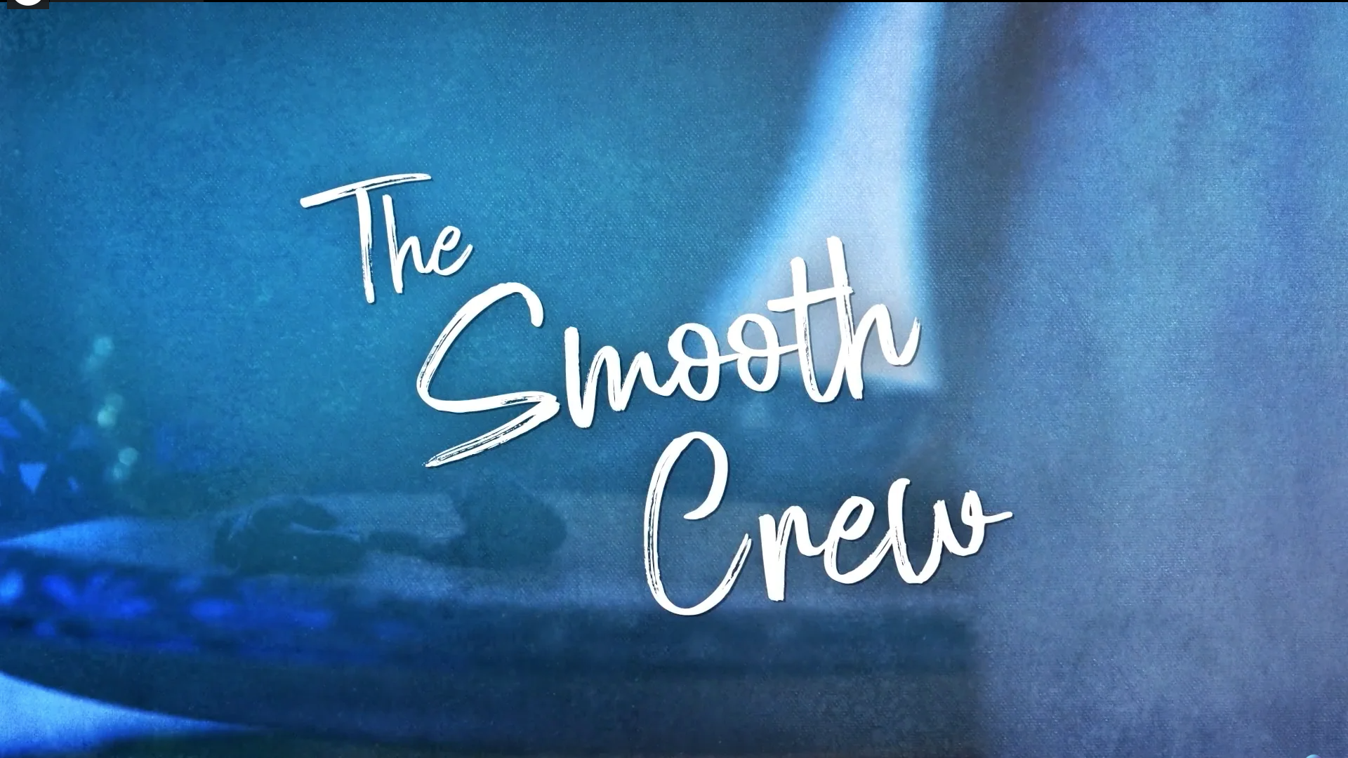 Text: The Smooth Crew with a blue background