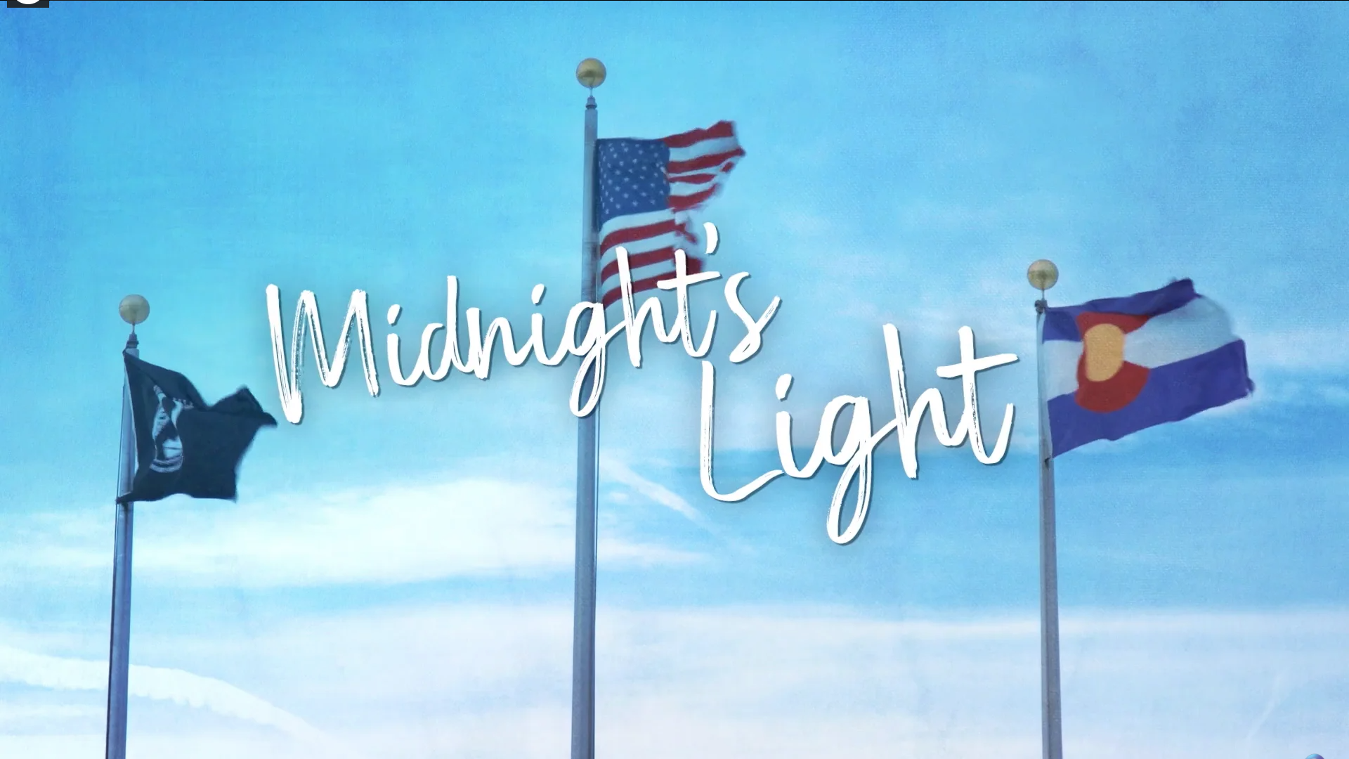 Text: Midnight's Light, pictured with three flags