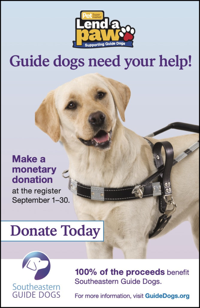A Pet Supermarket Checkout poster promoting Southeastern Guide Dogs.