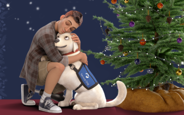 An animated veteran with a prosthetic leg kneels and embraces a yellow lab service dog in front of a Christmas tree.